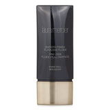 Laura Mercier Smooth Finish Flawless Fluide in #Chestnut, 30ml, offers sheer coverage and a radiant finish for normal to oily skin.