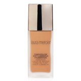 Laura Mercier Candleglow Foundation in 5N1 Pecan, a lightweight formula enhancing natural beauty with a luminous finish.