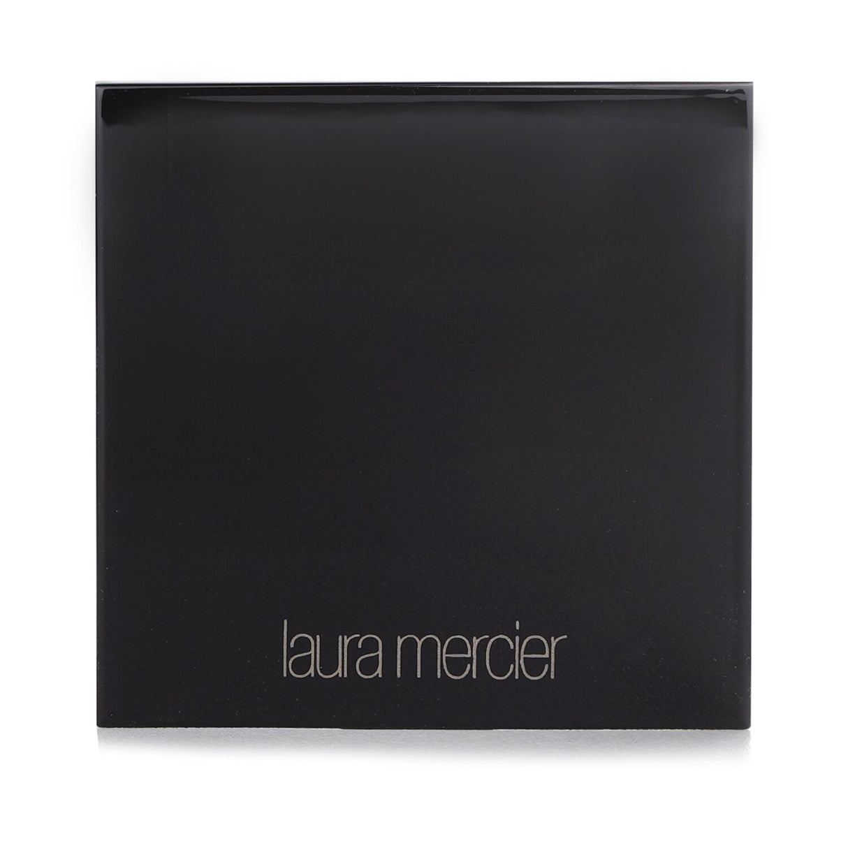 Laura Mercier Face Illuminator in #Seduction, a radiant highlighting powder with customizable glow for face, eyes, and décolletage.