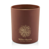 Luxurious Miller Harris candle in 185g, with a powdery fragrance and 40-hour burn time for a warm ambiance.