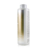 Joico Blonde Life Brightening Shampoo (1000ml) enhances blonde hair with hydration, shine, and brassy tone control.