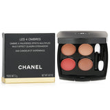 Chanel eye shadow quad No. 268 features four blendable shades for versatile looks, housed in a sleek compact with applicators.