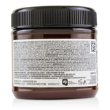 Davines Alchemic Conditioner in Tobacco enhances golden and honey blonde tones while deeply conditioning and adding shine.