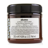 Davines Alchemic Conditioner in Tobacco shade enhances and conditions natural or colored golden and honey blonde hair.