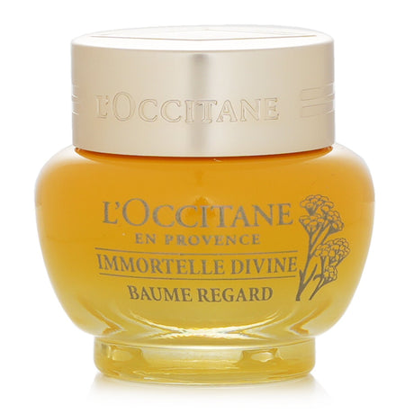 L'Occitane Immortelle Divine Eye Balm in a 15ml jar, designed to hydrate and rejuvenate the eye area, combating aging signs.