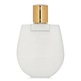 Luxurious 200ml Chloe Nomade body lotion; hydrates and fragrances skin with a lightweight, soothing texture.