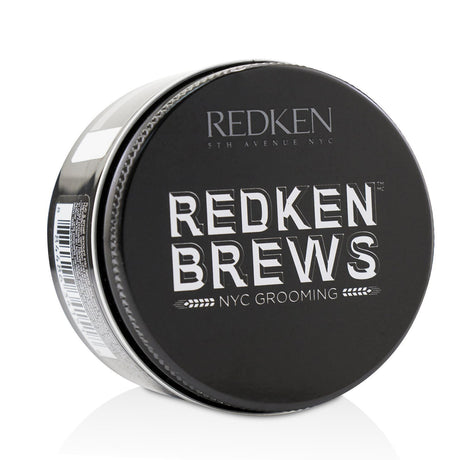 Redken Brews Maneuver Cream Pomade in a 100ml tube, offering medium control and smooth finish for versatile men's hairstyles.