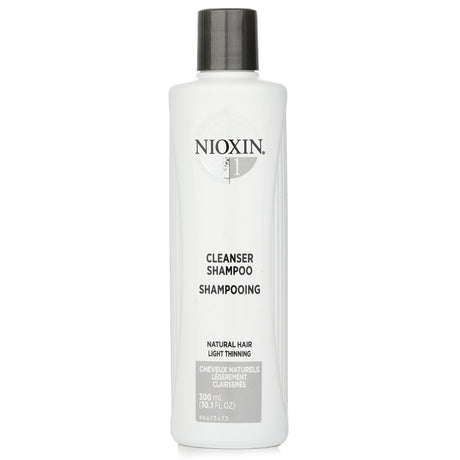 Nioxin Cleanser Shampoo for natural hair, promotes thicker, healthier hair by removing impurities and preparing for thickening treatment.