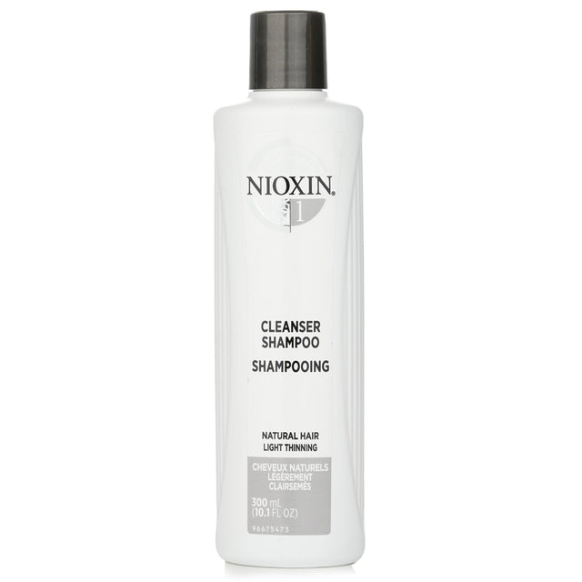 Nioxin Cleanser Shampoo for natural hair, promotes thicker, healthier hair by removing impurities and preparing for thickening treatment.