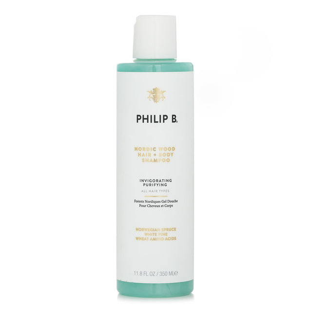 Philip B Nordic Wood Hair + Body Shampoo bottle displaying invigorating botanical ingredients for gentle cleansing.