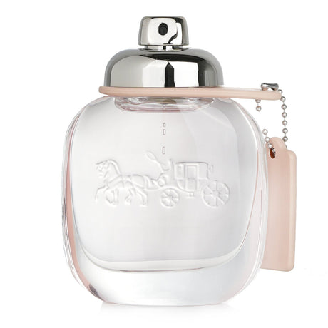 Coach Eau De Toilette Spray 50ml: Floral fruity fragrance with pear, rose, and sandalwood notes; perfect for spring and summer.