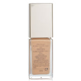 ADDICTION Glow Foundation SPF 20 in shade #012 (Sand) provides radiant, sheer coverage for a natural, dewy complexion.
