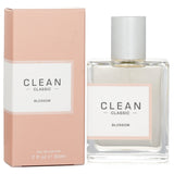 Clean - Classic Blossom Eau De Parfum Spray in a sleek bottle, featuring floral notes of neroli, lilac, and orange blossom.