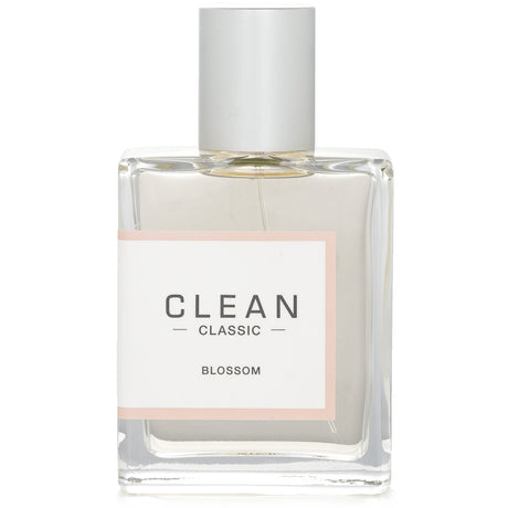 Clean - Classic Blossom Eau De Parfum Spray in a sleek bottle, featuring fresh floral notes perfect for daily wear or special occasions.