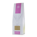 Contemporary glass cube diffuser filled with Ylangs' Sun fragrance, designed for optimal scent diffusion in stylish decor.