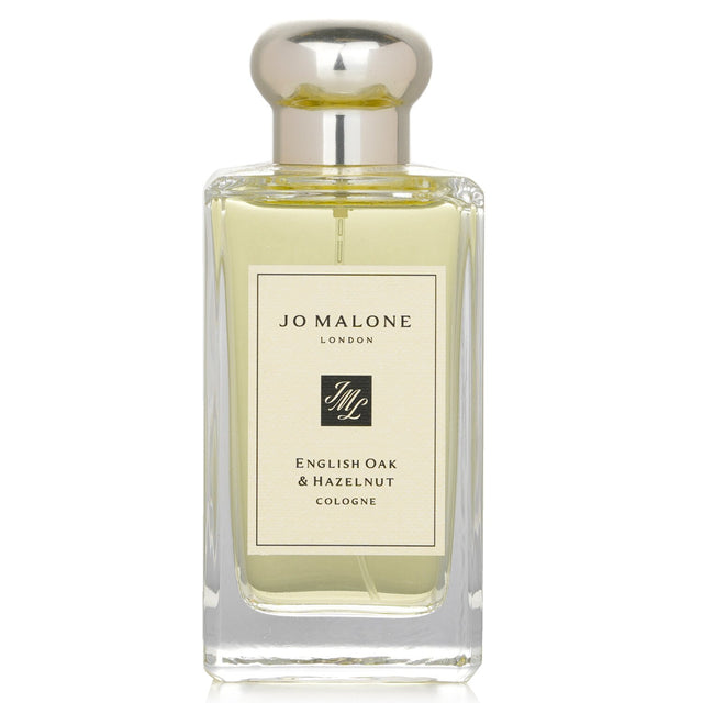 Jo Malone English Oak & Hazelnut Cologne Spray in a 100ml bottle, featuring woody, spicy notes of hazelnut, cedar, and oak.