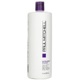 Paul Mitchell Extra-Body Shampoo in a 1000ml bottle, thickening and volumizing fine hair with natural extracts and panthenol.