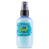 Bumble and Bumble Surf Infusion spray for soft, beachy waves, enriched with oils, minerals, and UV protection for shiny hair.