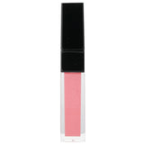 Vibrant Edward Bess lip gloss in #25 Stolen Kiss for a satiny, seductive pout with exceptional moisture and luster.