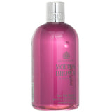 Molton Brown Fiery Pink Pepper Bath & Shower Gel in a 300ml bottle, featuring a luxurious fruity-spicy scent for a revitalizing cleanse.
