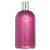 Luxurious 300ml bottle of Molton Brown Fiery Pink Pepper Bath & Shower Gel, enhances cleansing with fruity-spicy fragrance.