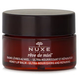 Nuxe Reve De Miel Honey Lip Balm in random packaging, nourishing very dry lips with honey and botanical oils, 15g.