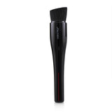 Shiseido Hasu Fude Foundation Brush featuring a uniquely angled design and densely packed bristles for flawless makeup application.