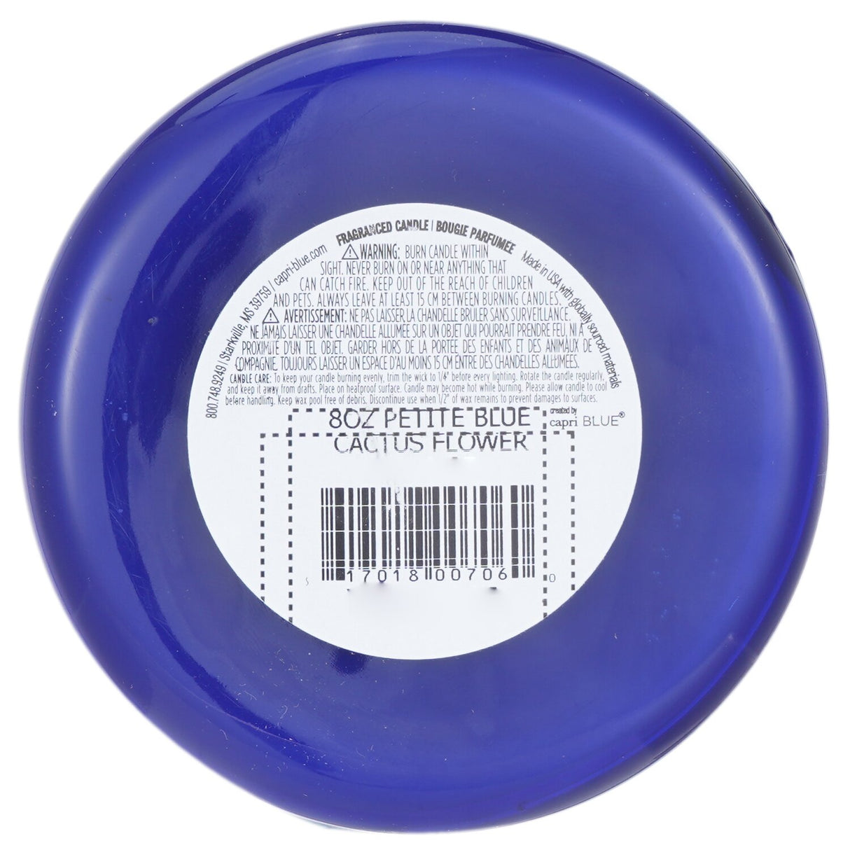 Blue jar candle in Cactus Flower scent with sweet peonies and peach, burns for 25 hours; perfect for home decor.