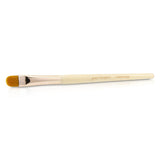 Camouflage brush with rose gold handle, designed for smooth application of cream cosmetics, ideal for precise areas.