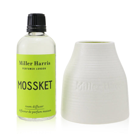 Luxurious Miller Harris Mossket diffuser in artisan ceramic pot, featuring five natural wood reeds for a captivating home fragrance.