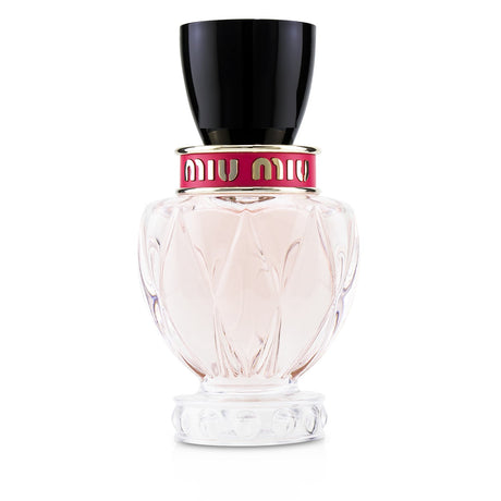 Miu Miu Twist Eau De Parfum Spray 30ml features a floral woody scent with bergamot, apple blossom, cedarwood, and amber.