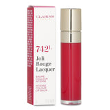 Vibrant red Joli Rouge Lacquer lipstick by Clarins, combining vinyl shine with nourishing balm for hydrated, plump lips.