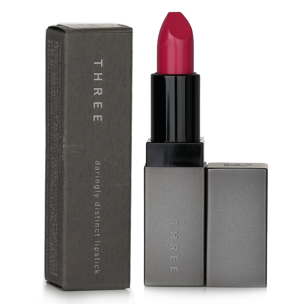 Luxurious THREE lipstick in #07 Dare 2B Decorous, a chic camellia shade for vibrant color and all-day elegance.