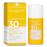 Clarins Mineral Sun Care Fluid SPF 30 in a 30ml bottle, providing tinted sun protection for sensitive areas with water-resistant formula.
