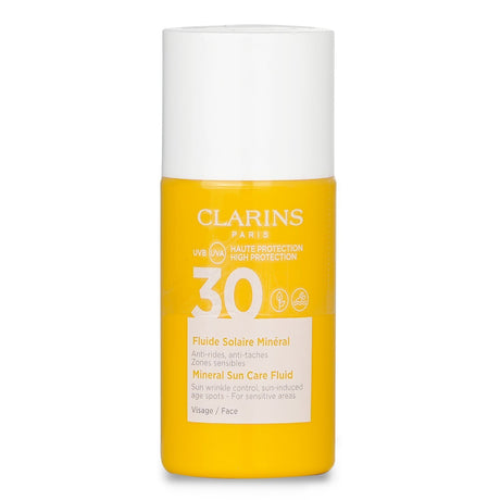 Clarins Mineral Sun Care Fluid SPF 30 for face, tinted, waterproof, and designed for sensitive areas, in a 30ml portable bottle.