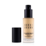 Bobbi Brown Skin Long Wear Foundation in Warm Ivory, 30ml, offers full coverage with a natural matte finish and SPF 15.