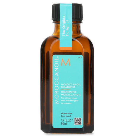 Moroccanoil Treatment Original 50ml, a versatile oil for all hair types, enhances shine while reducing frizz and nourishing hair.