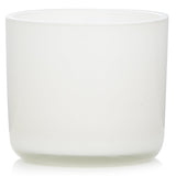 A 85g natural wax aromatherapy candle in glass, infused with uplifting essential oils for a tranquil ambiance.