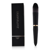 Youngblood YB4 Foundation Brush with firm, flat bristles for even application, made of soft, vegan Taklon fibers.