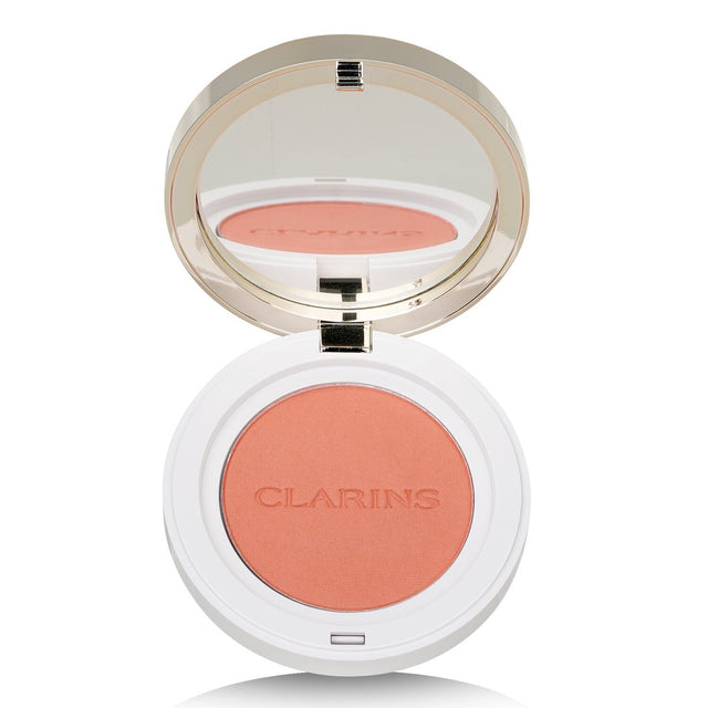 Clarins Joli Blush #07 Cheeky Peach: customizable color, nourishing Hazelnut oil, and anti-pollution protection for radiant cheeks.