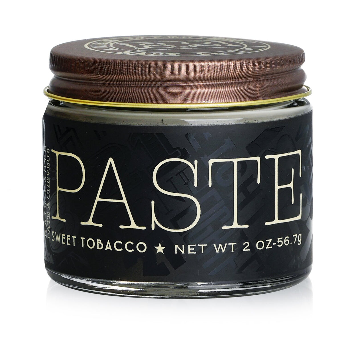 Luxurious 18.21 Man Made Sweet Tobacco Paste with satin finish, medium hold, and nourishing oils for healthy, styled hair.