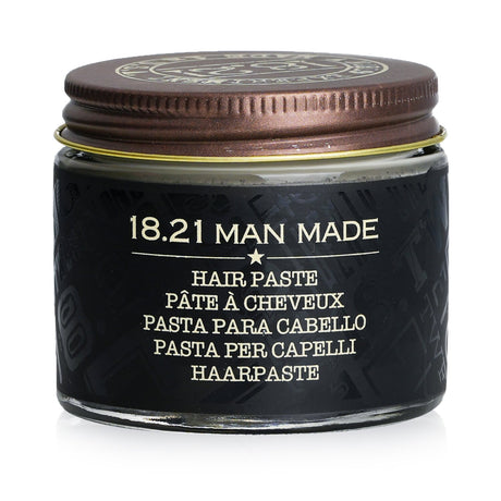 Luxurious 18.21 Man Made Paste in Sweet Tobacco, offering medium hold and satin finish for versatile men's hairstyles.