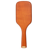 Aveda Wooden Mini Paddle Brush featuring a unique bristle design for effective drainage and eco-friendly hair care.