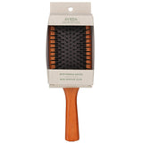 Aveda Wooden Mini Paddle Brush: eco-friendly, lightweight detangler with unique ventilation feature, perfect for all hair types.