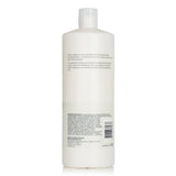 Wella Nutricurls Micellar Shampoo for curls, 1000ml, enriched with jojoba oil for soft, defined, and frizz-free hair.