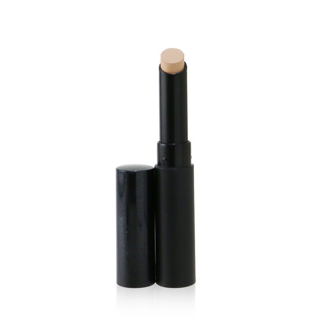 Full-coverage concealer stick in light to medium with peach undertones for a flawless, skin-like finish.