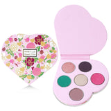 Heart-shaped Winky Lux Smitten Palette featuring six highly pigmented shimmer and matte eyeshadows for versatile eye looks.