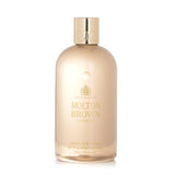 Molton Brown Jasmine & Sun Rose Bath & Shower Gel in 300ml, offering a luxurious floral and fruity scent for a refreshing cleanse.