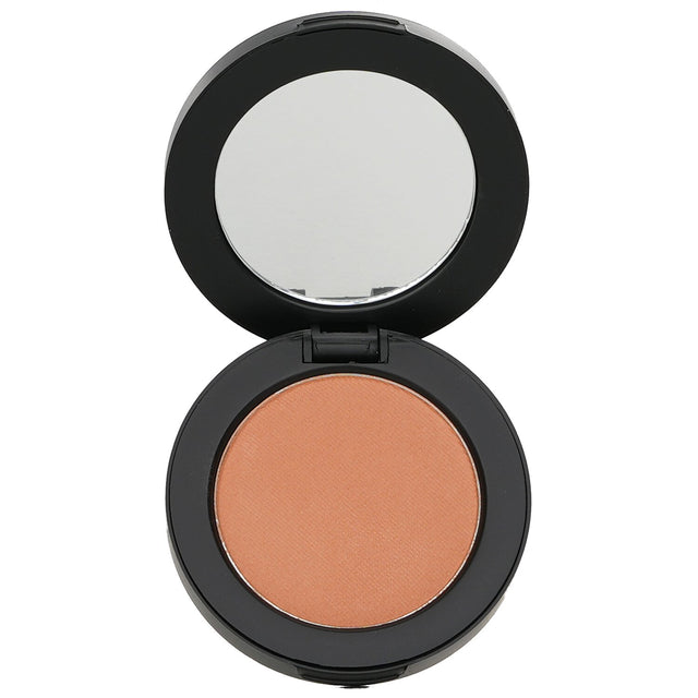 Youngblood Pressed Mineral Blush in Gilt, a lightweight blush for a radiant glow, suitable for cheeks, eyes, and lips.