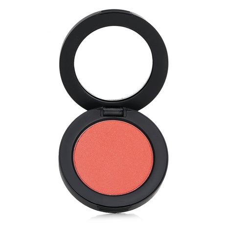 Youngblood Pressed Mineral Blush in Posh, a sheer powder delivering a radiant flush for cheeks, eyes, and lips.